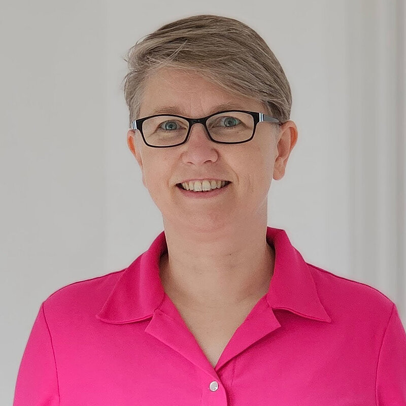 Holly Gunning in a bright pink shirt
