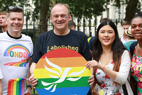 Ed Davey at pride Ed Davey with fellow Liberal Democrats at pride holding a Lib Dem pride poster