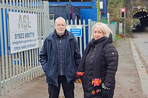 Cllrs Alan Matthews and Louise Nicolas outside the ASL yard on Bushey Hall Road