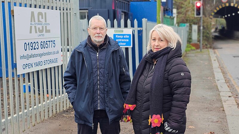 Cllrs Alan Matthews and Louise Nicolas outside the ASL yard on Bushey Hall Road