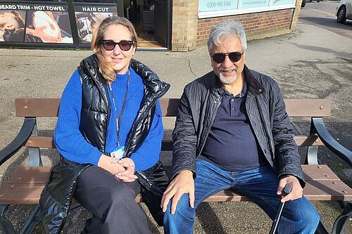 Bushey Lib Dem councillors sitting on village bench