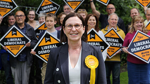 Emma Matanle surrounded by supporters